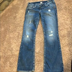Silver boot cut distressed jeans